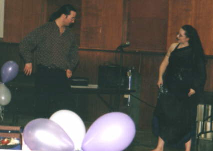 Kristen giving Alain some pointers.  The first belly dancing volunteer  - little did Kristen know how quickly he would take to it or what a real Canadian male belly might look like....